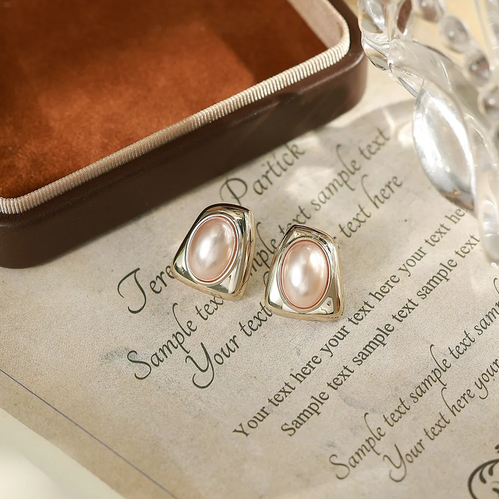 O1CN01Jn0MKU2BaeHqjiTOt_2214616708355-0-cib Korean Red Pearl Oval Gold Stud Earrings - Image 1