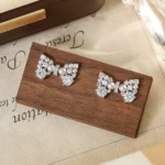 Manta Rose Pearl Bow Stud Earrings