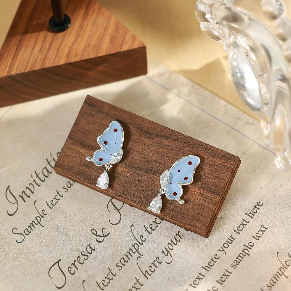 O1CN01ZfROqC2BaeHdYbWBZ_2214616708355-0-cib Polka Dot Butterfly Stud Earrings - Image 1